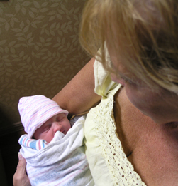 Carla holding Zoey a few hours after she was born.